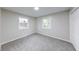 Bedroom featuring carpet flooring and two windows, as well as fresh neutral paint at 444 Buffalo Dr, Indianapolis, IN 46217