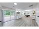 Open concept kitchen and dining area with deck access, featuring modern finishes and natural light at 444 Buffalo Dr, Indianapolis, IN 46217