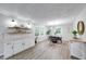 Bright dining room featuring modern lighting, wood floors, and large windows at 444 Buffalo Dr, Indianapolis, IN 46217