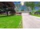 Charming single-story home with stone facade, attached garage, bright yellow door, and well-maintained lawn at 444 Buffalo Dr, Indianapolis, IN 46217