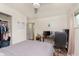 Bedroom featuring light grey bedding, wood floors, workspace, and a ceiling fan at 4716 E 33Rd St, Indianapolis, IN 46218