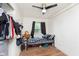 Bright bedroom with wood-look floors, ceiling fan, and closet at 4716 E 33Rd St, Indianapolis, IN 46218