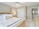 Bedroom with large bed, side table, a closet and neutral colored walls at 4732 Ferguson Rd, Indianapolis, IN 46239