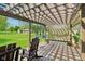 Cozy outdoor deck with pergola, hammocks, and seating for ultimate relaxation at 4732 Ferguson Rd, Indianapolis, IN 46239