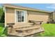 Spacious wooden deck with built-in seating and steps, ideal for outdoor relaxation and entertaining guests in backyard at 4732 Ferguson Rd, Indianapolis, IN 46239