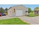 Detached three car garage with additional parking, lighting, and green space at 4732 Ferguson Rd, Indianapolis, IN 46239