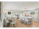Eat-in kitchen features stylish white cabinets, barstool seating, and modern pendant lighting at 4732 Ferguson Rd, Indianapolis, IN 46239