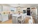 Stylish kitchen features a center island, stainless steel appliances, and bright white cabinets at 4732 Ferguson Rd, Indianapolis, IN 46239