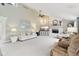Bright living room featuring vaulted ceilings, fireplace, neutral colors and large windows at 4732 Ferguson Rd, Indianapolis, IN 46239