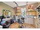 Salon area with chair, sink, cabinets, tile floor, and track lighting at 4732 Ferguson Rd, Indianapolis, IN 46239