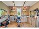 Salon area with chair, sink, cabinets, tile floor, and track lighting at 4732 Ferguson Rd, Indianapolis, IN 46239