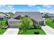 Charming single Gathering home featuring a manicured lawn, brick accents, and an attached two car garage at 4965 Eldon Dr, Noblesville, IN 46062