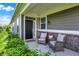 Cozy front porch with comfortable seating, a welcoming entrance, and charming curb appeal at 4965 Eldon Dr, Noblesville, IN 46062