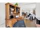 Comfortable office space features a desk, chair, and view of living area at 4965 Eldon Dr, Noblesville, IN 46062