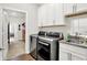 Functional laundry room features washer/dryer, sink, cabinets, and convenient access to other areas at 4965 Eldon Dr, Noblesville, IN 46062