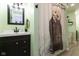 This bathroom features an otter-themed shower curtain, modern fixtures, and stylish decor at 5015 E 70Th E St, Indianapolis, IN 46220