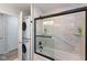 This bathroom has a tub-shower combo, tiled walls, and a stacked washer dryer at 5015 E 70Th E St, Indianapolis, IN 46220