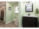 This bathroom has a shower-tub combo with a bright green color scheme and stylish decor at 5015 E 70Th E St, Indianapolis, IN 46220