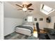 This bedroom features wood floors, a ceiling fan, and plenty of natural light at 5015 E 70Th E St, Indianapolis, IN 46220
