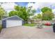 Spacious backyard with a patio, garage, playground, and green space for outdoor activities at 5224 Boulevard Pl, Indianapolis, IN 46208