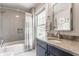 Bathroom featuring a shower and tub combo, subway tile, and natural light at 5224 Boulevard Pl, Indianapolis, IN 46208