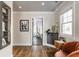 Bedroom area showcasing wood floors, a decor shelving unit, and access to an ensuite bathroom at 5224 Boulevard Pl, Indianapolis, IN 46208
