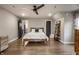 Bedroom featuring hardwood floors, a ceiling fan, and natural light at 5224 Boulevard Pl, Indianapolis, IN 46208