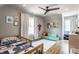 bedroom with hardwood floors, ceiling fan, and stylish decor at 5224 Boulevard Pl, Indianapolis, IN 46208