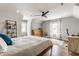 Bright bedroom featuring hardwood floors, a ceiling fan, and natural light at 5224 Boulevard Pl, Indianapolis, IN 46208