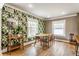 Dining room with patterned wallpaper, hardwood floors, and ample natural light from the windows at 5224 Boulevard Pl, Indianapolis, IN 46208