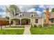 Charming stone home with a welcoming front porch and well-manicured lawn at 5224 Boulevard Pl, Indianapolis, IN 46208
