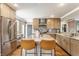 A modern kitchen featuring an island, stainless steel appliances, and sleek countertops at 5224 Boulevard Pl, Indianapolis, IN 46208