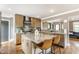 Bright kitchen featuring a large island with countertop seating and modern fixtures at 5224 Boulevard Pl, Indianapolis, IN 46208