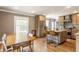Bright and spacious kitchen featuring island seating, stainless appliances, and hardwood floors at 5224 Boulevard Pl, Indianapolis, IN 46208