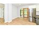 Gourmet kitchen with stainless steel appliances, wine cooler, ample counter space, and access to a screened patio at 5721 Daphne Dr, Indianapolis, IN 46278