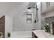 Modern bathroom boasting tiled walls, sleek fixtures, and a soaking tub at 5811 King Ave, Indianapolis, IN 46228