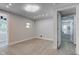 Well-lit bedroom with a neutral color palette and hardwood floors, with several large windows at 5811 King Ave, Indianapolis, IN 46228