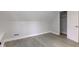 This bedroom features light wood floors, angled ceilings and neutral paint color at 5811 King Ave, Indianapolis, IN 46228