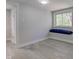 Bedroom boasts wood floors, a window seat, with natural light, creating a comfortable atmosphere at 5811 King Ave, Indianapolis, IN 46228