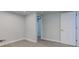 Neutral-colored bedroom with hardwood floors and access to a second room and ensuite bathroom at 5811 King Ave, Indianapolis, IN 46228