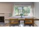 Sunlit dining room area with a large window overlooking the backyard at 5811 King Ave, Indianapolis, IN 46228