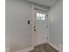 Bright entryway with a white door and modern hardware at 5811 King Ave, Indianapolis, IN 46228