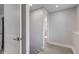 Hallway with a doorway leading to a room with a window at 5811 King Ave, Indianapolis, IN 46228