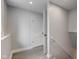 Hallway with stairs and a doorway leading to another room at 5811 King Ave, Indianapolis, IN 46228