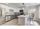 Modern kitchen with white cabinets, granite countertops, and stainless steel appliances at 5811 King Ave, Indianapolis, IN 46228