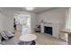 Open living room with hardwood floors, fireplace, and view of kitchen at 5811 King Ave, Indianapolis, IN 46228