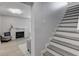 View of the living room with a brick fireplace, with stairs on the right at 5811 King Ave, Indianapolis, IN 46228