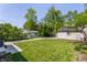 Fenced backyard includes detached garage and beautiful green grass at 5912 Evanston Ave, Indianapolis, IN 46220