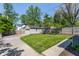 Fenced backyard includes detached garage and paved parking spaces at 5912 Evanston Ave, Indianapolis, IN 46220