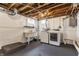 Unfinished basement laundry area with sink and appliances offers convenience at 5912 Evanston Ave, Indianapolis, IN 46220